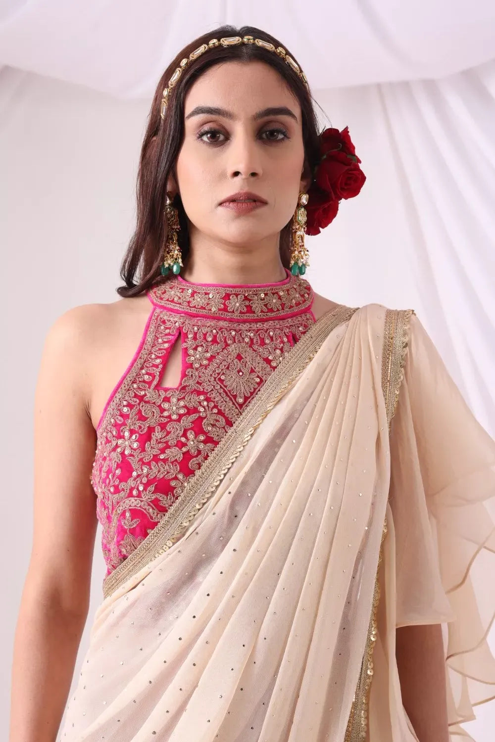 Beige Draped Saree with Magenta Hulter Blouse