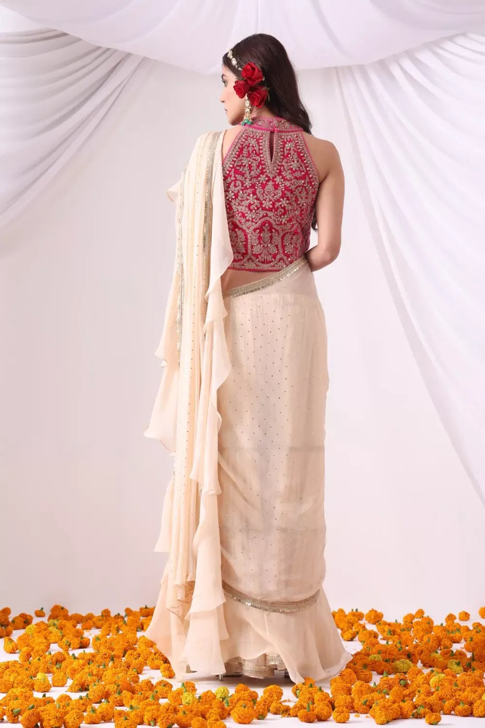 Beige Draped Saree with Magenta Hulter Blouse