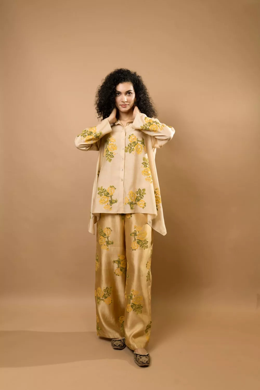 Beige rosettes block-printed asymmetrical hem shirt