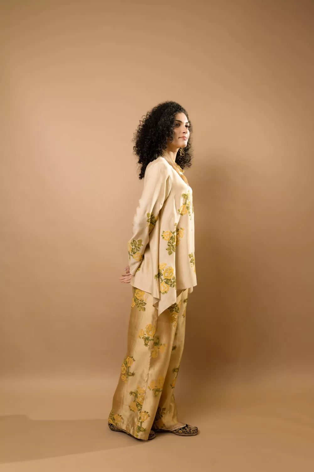 Beige rosettes block-printed asymmetrical hem shirt