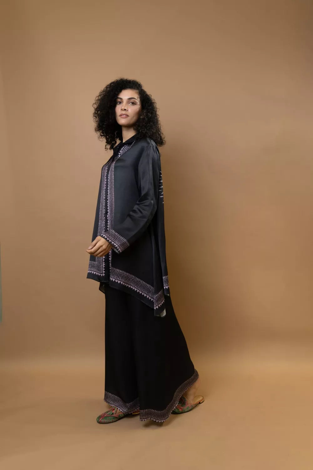 A black bold and stylish block-printed asymmetric shirt
