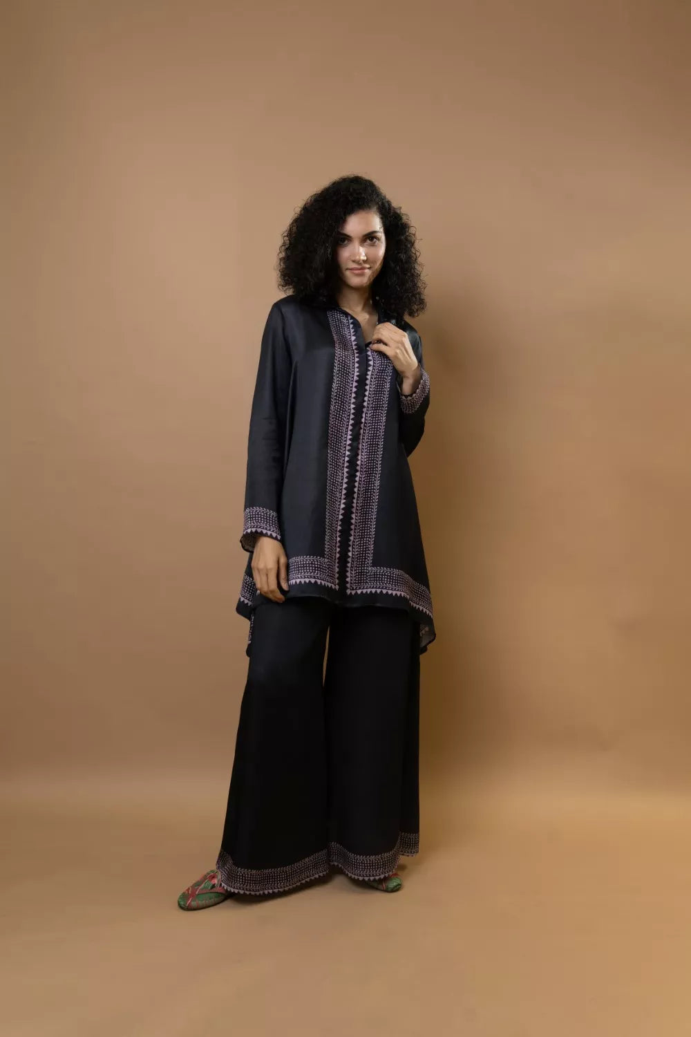 A black bold and stylish block-printed asymmetric shirt