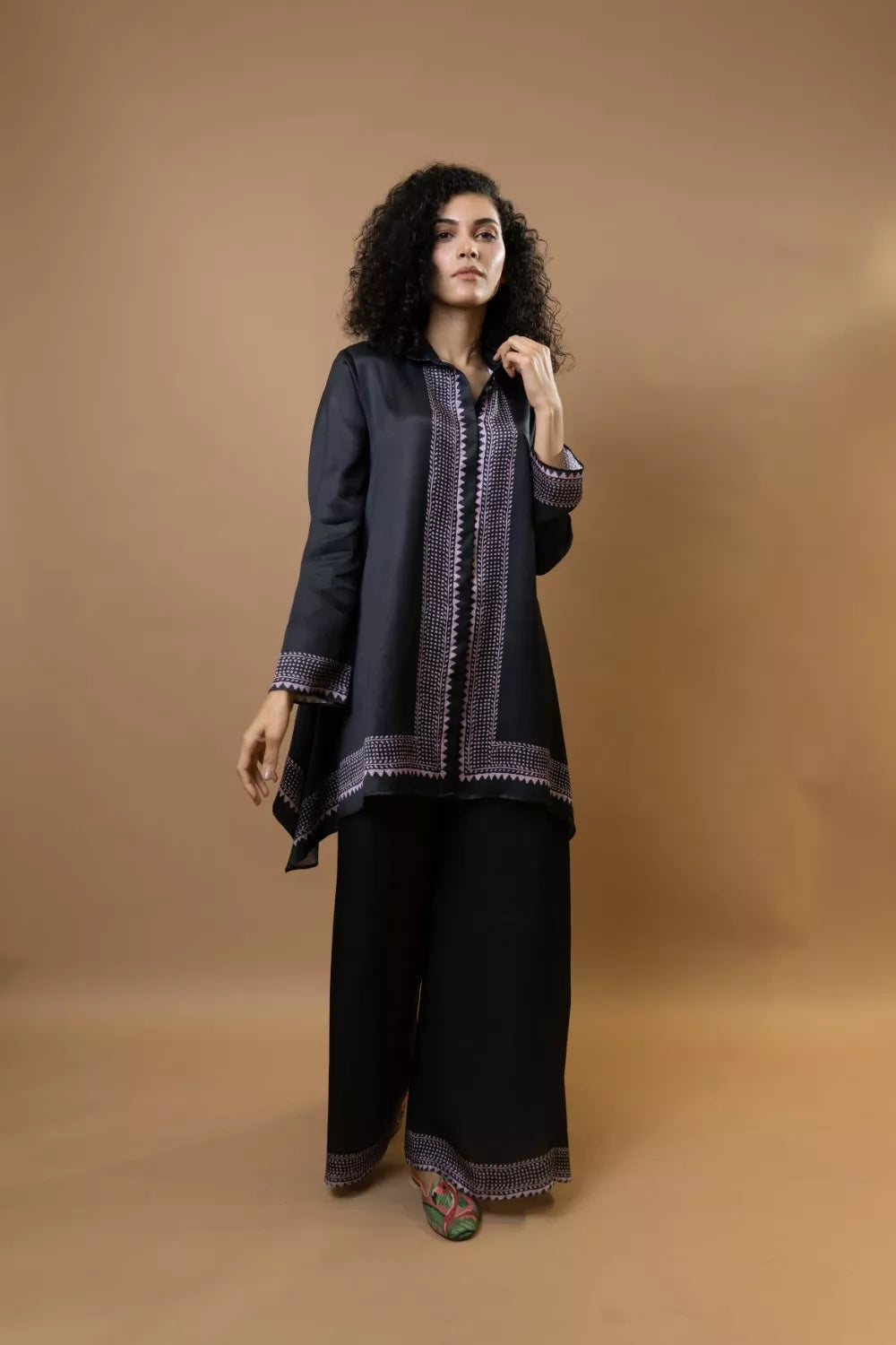 A black bold and stylish block-printed asymmetric shirt
