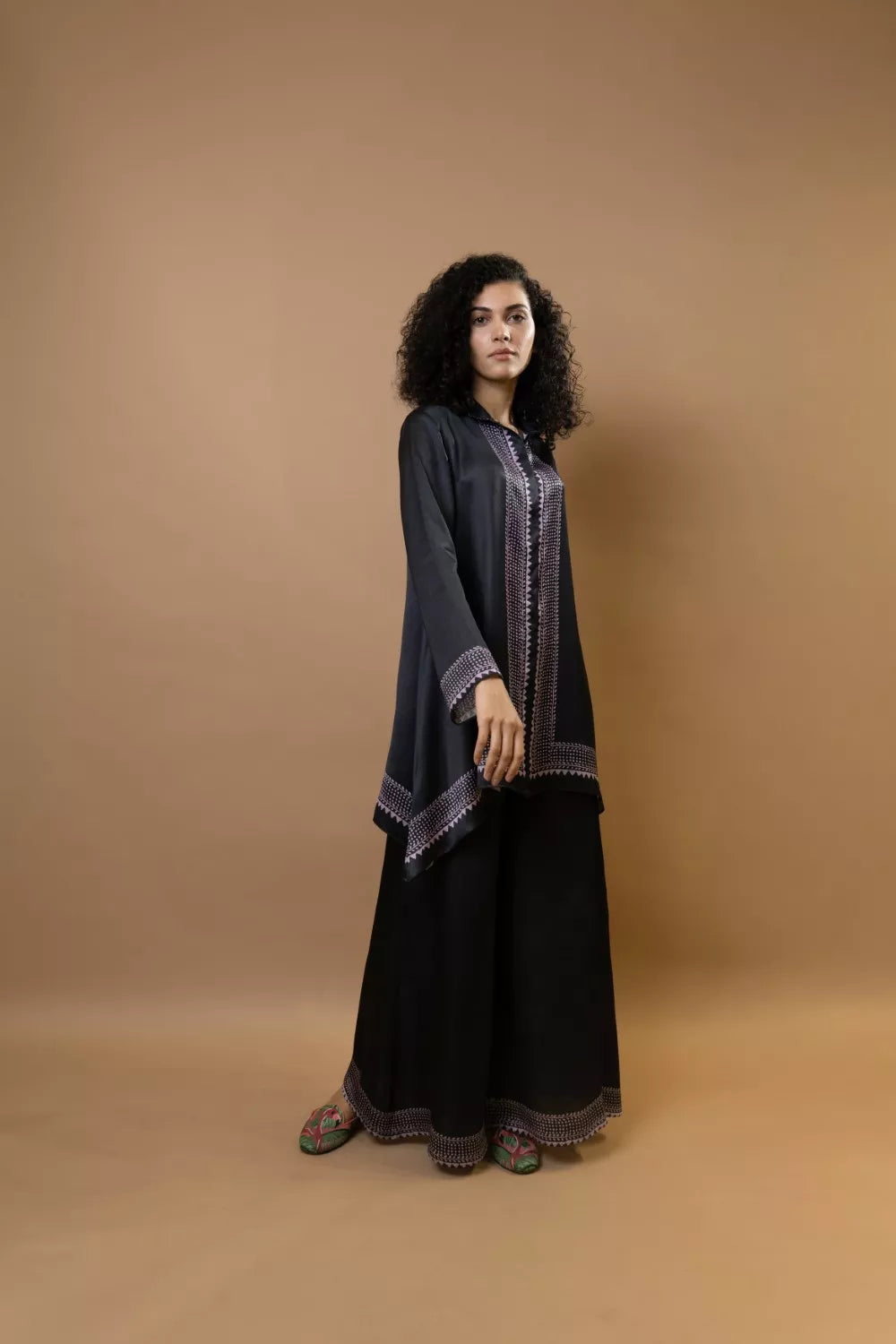 A black bold and stylish block-printed asymmetric shirt