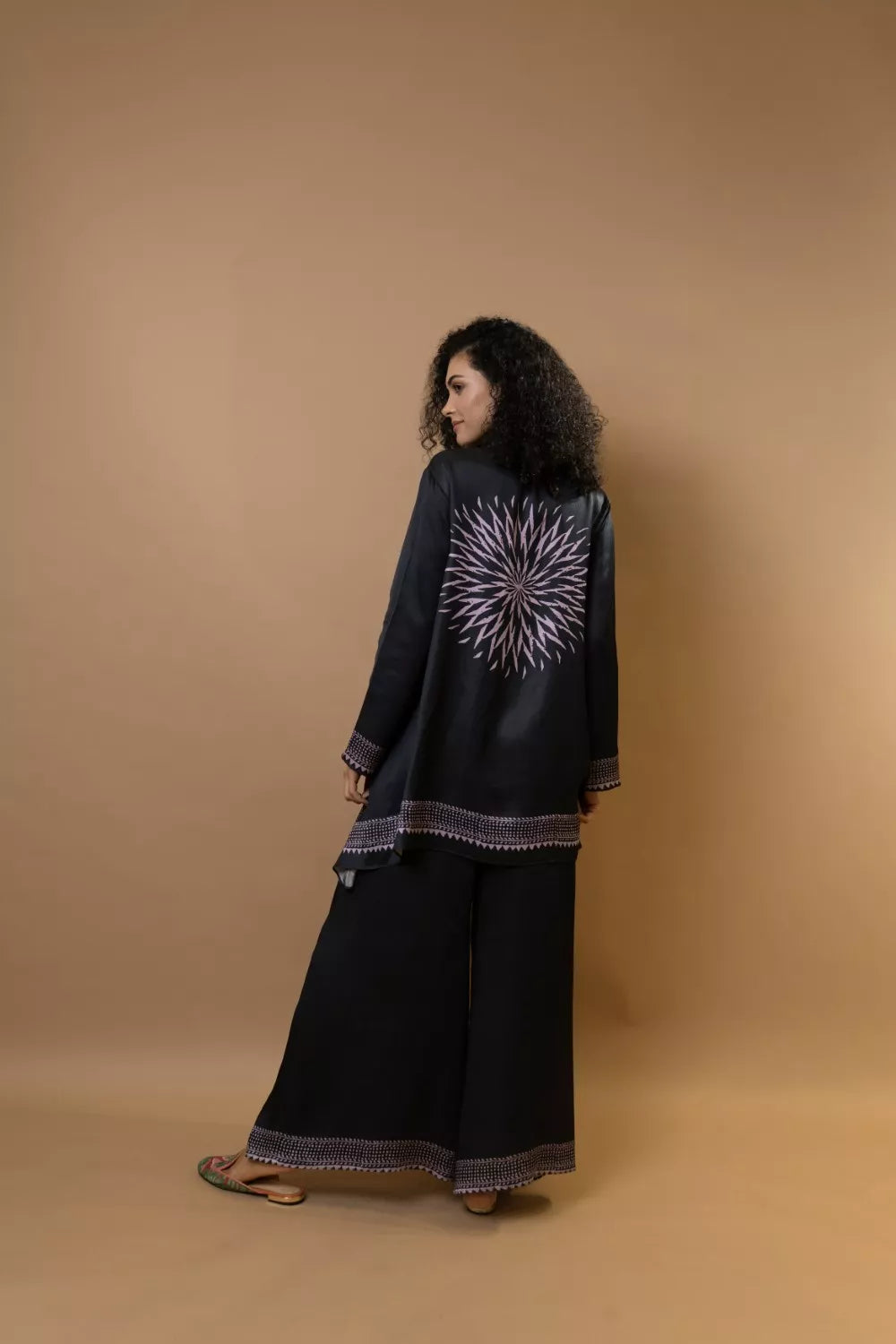 A black bold and stylish block-printed asymmetric shirt